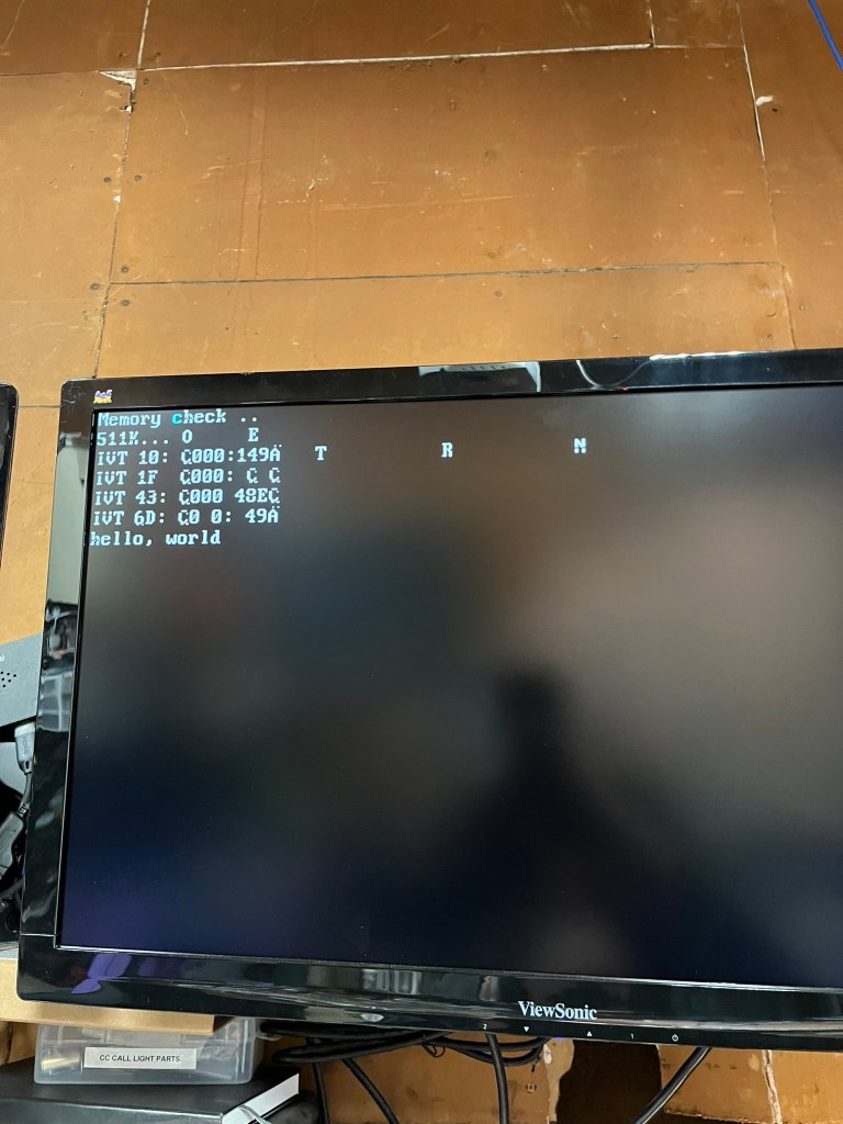 A photo of slightly garbled text on a monitor.